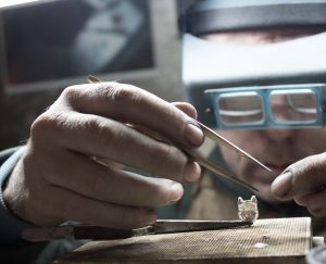 Soldering the bail onto a beautiful silver wolf pendant Soldering the bail onto a beautiful silver wolf pendant