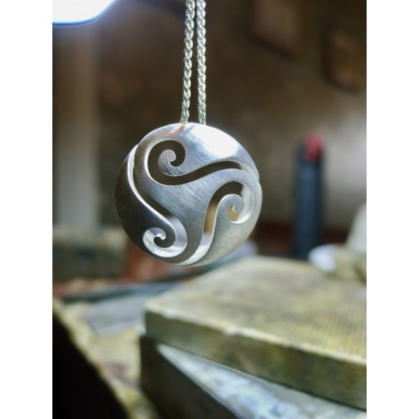 Celtic Triple Spiral Pendant - shown here before polishing - a beautiful and meaningful piece of Irish jewelry that symbolises the eternal cycle of life, death, and rebirth. The intricate cut-out design of the three spirals, creates a mesmerising piece th Celtic Triple Spiral Pendant - shown here before polishing - a beautiful and meaningful piece of Irish jewelry that symbolises the eternal cycle of life, death, and rebirth. The intricate cut-out design of the three spirals, creates a mesmerising piece th