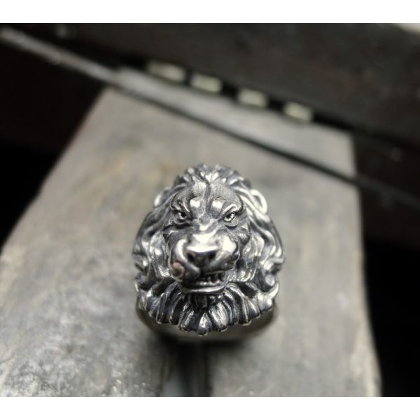 Introducing the Silver Lions Head Ring with Flowing Mane - a stunning piece of Irish jewelry that embodies power and strength. With its intricate design and captivating detail, this ring is the perfect accessory for anyone who wants to make a bold stateme Introducing the Silver Lions Head Ring with Flowing Mane - a stunning piece of Irish jewelry that embodies power and strength. With its intricate design and captivating detail, this ring is the perfect accessory for anyone who wants to make a bold stateme