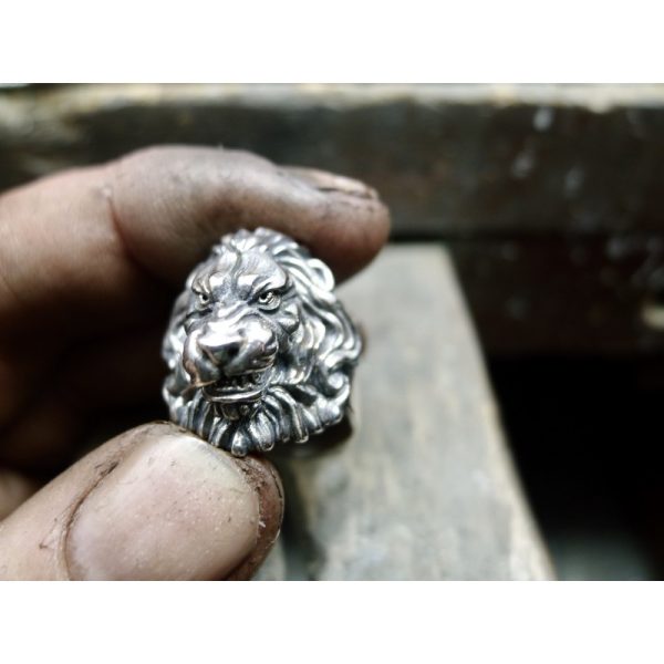 Photographed in the jewellers hands - This silver lions head ring with flowing mane is not just a piece of Irish jewelry - it is a symbol of courage, bravery, and resilience. Whether you're looking for a unique accessory to wear every day or a special gif Photographed in the jewellers hands - This silver lions head ring with flowing mane is not just a piece of Irish jewelry - it is a symbol of courage, bravery, and resilience. Whether you're looking for a unique accessory to wear every day or a special gif