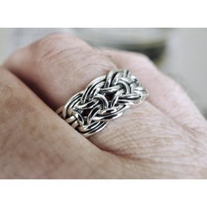 Close up of a handcrafted silver viking ring