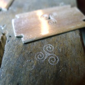 Grooming: The razor shape is associated with personal grooming, reflecting the wearer's attention to their appearance and well-being. The Triple Goddess: In Celtic myth, the triple spiral is associated with the three phases of the moon Grooming: The razor shape is associated with personal grooming, reflecting the wearer's attention to their appearance and well-being. The Triple Goddess: In Celtic myth, the triple spiral is associated with the three phases of the moon