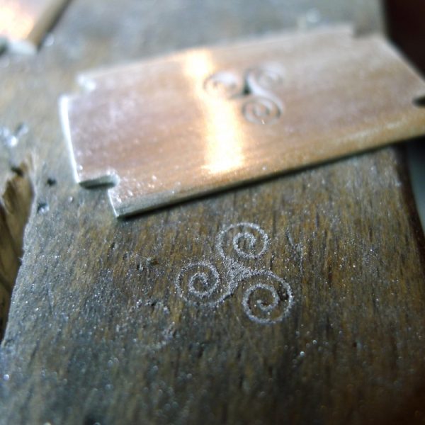 Grooming: The razor shape is associated with personal grooming, reflecting the wearer's attention to their appearance and well-being. The Triple Goddess: In Celtic myth, the triple spiral is associated with the three phases of the moon Grooming: The razor shape is associated with personal grooming, reflecting the wearer's attention to their appearance and well-being. The Triple Goddess: In Celtic myth, the triple spiral is associated with the three phases of the moon