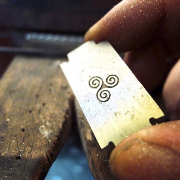 Shown here as a work in progress.Innovation: The modern and contemporary design of the pendant reflects the wearer's embrace of innovation and cutting-edge design. Shown here as a work in progress. Innovation: The modern and contemporary design of the pendant reflects the wearer's embrace of innovation and cutting-edge design.