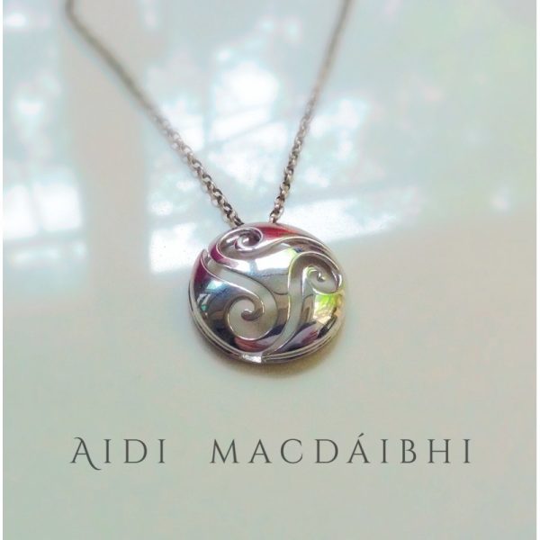 The smooth, polished surface of the pendant is set against the cut-out design of the spirals, This pendant is a true celebration of Celtic heritage and culture, making it a perfect Irish gift for anyone with an appreciation of Irish jewelry and design The smooth, polished surface of the pendant is set against the cut-out design of the spirals, This pendant is a true celebration of Celtic heritage and culture, making it a perfect Irish gift for anyone with an appreciation of Irish jewelry and design