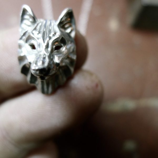 Another fine close up of irish jewellery, crafted by hand.Silver wolf necklace Another fine close up of irish jewellery, crafted by hand. Silver wolf necklace