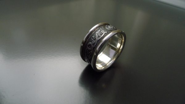 Irish jewellery with oxidised centre. Shown here with round rims Irish jewellery with oxidised centre. Shown here with round rims