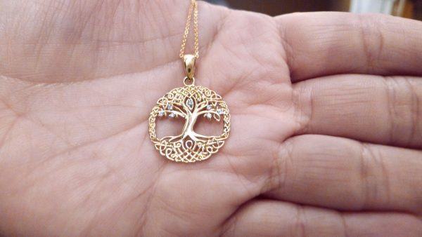 Close up view of Gold Tree of Life pendant. Irish jewellery Close up view of Gold Tree of Life pendant. Irish jewellery