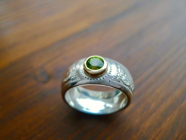 Domed silver Celtic ring with gold bezel. Irish Jewellery, handcrafted in Ireland