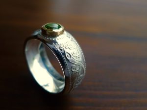 Beautiful domed Celtic ring set with an Emerald. Irish Jewellery handcrafted in County Kerry Ireland