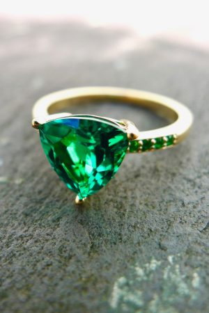 Close up of Emerald ring on slate. Irish jewellery