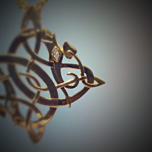 Close up shown with diamond bezel set in the eye of the dragon