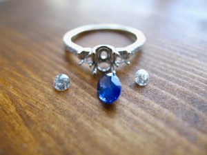 before the gemstones are set into a white gold engagement ring before the gemstones are set into a white gold engagement ring