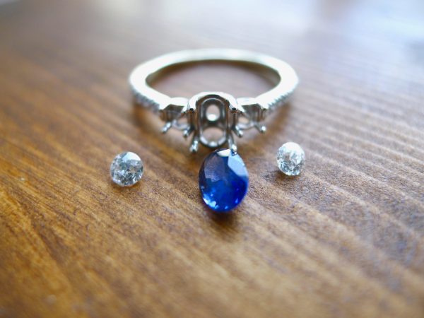 before the gemstones are set into a white gold engagement ring before the gemstones are set into a white gold engagement ring