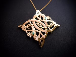 Irish jewellery in the form of a dragons pendant with Emerald eyes