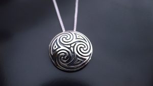 Irish jewellery in the form of a Celtic spiral pendant symbolising an ancient shield