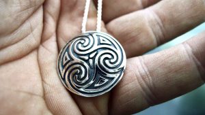 Closeup of an Irish jewellery Shield pendant. Celtic jewellery