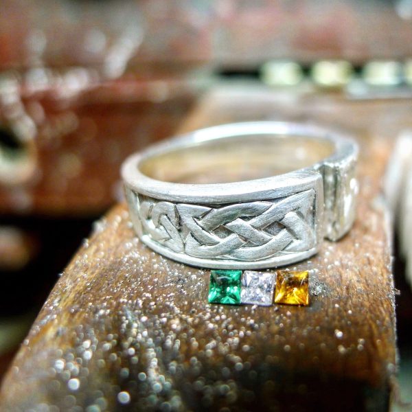 Work in progress photo - the crafting of an Irish Flag Ring in County Kerry, Ireland.Handcrafted Celtic ring with Irish flag. Emerald, Diamond and Citrine Work in progress photo - the crafting of an Irish Flag Ring in County Kerry, Ireland. Handcrafted Celtic ring with Irish flag. Emerald, Diamond and Citrine