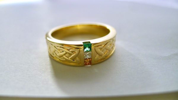 On either side of the Irish flag are hand carved Celtic knotwork designs, which symbolizes the interweaving of life and the continuity of the spirit. On either side of the Irish flag are hand carved Celtic knotwork designs, which symbolizes the interweaving of life and the continuity of the spirit.