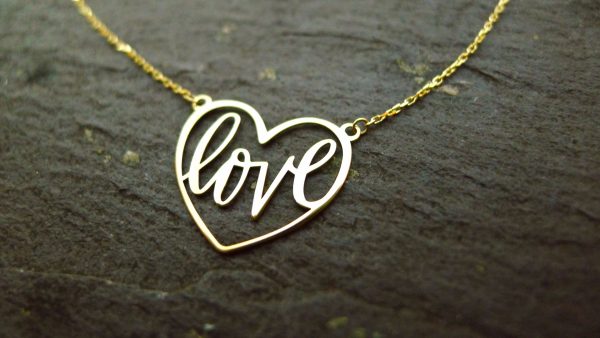 Irish jewellery crafted into the form of a heart with delicate calligraphy Irish jewellery crafted into the form of a heart with delicate calligraphy