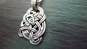 This Celtic Dragon pendant is reversible, as the design is carved on both sides This Celtic Dragon pendant is reversible, as the design is carved on both sides